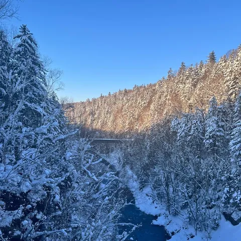 A snow-covered river valley in Biei