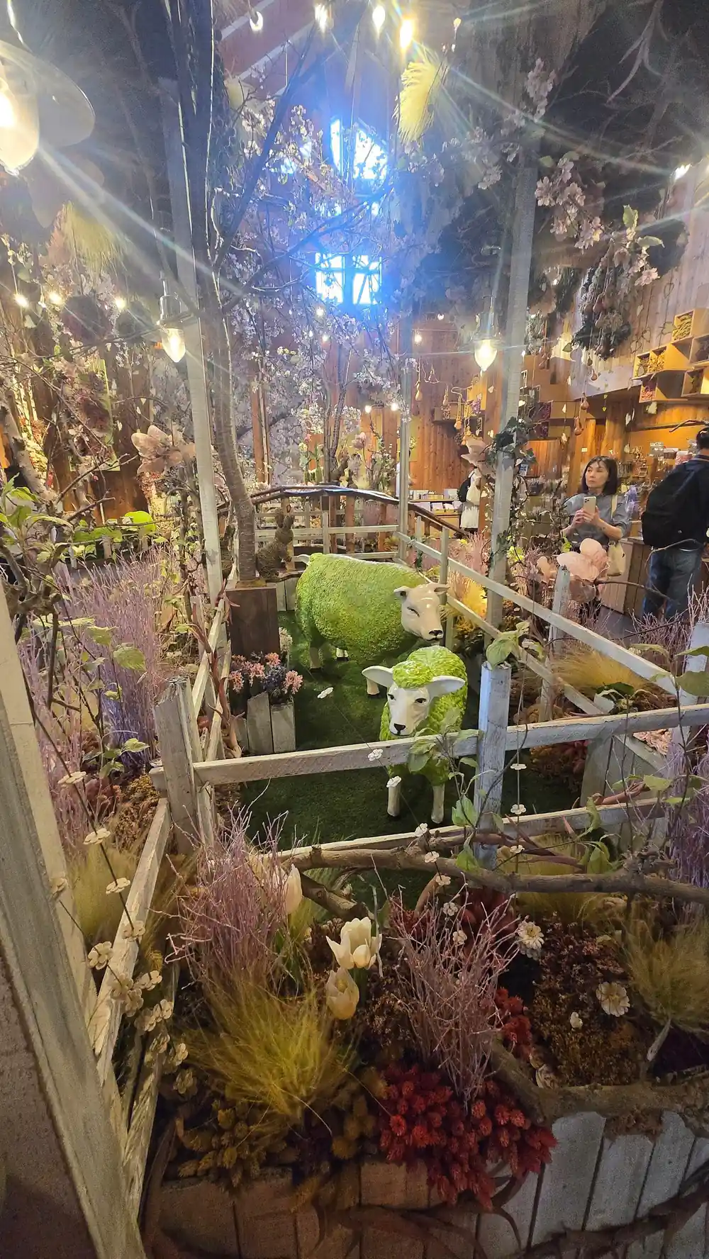 Indoor flower market or greenhouse with evening lighting